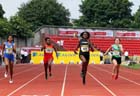 Neita Darryl  (London) wins the inter girls 400 metres.